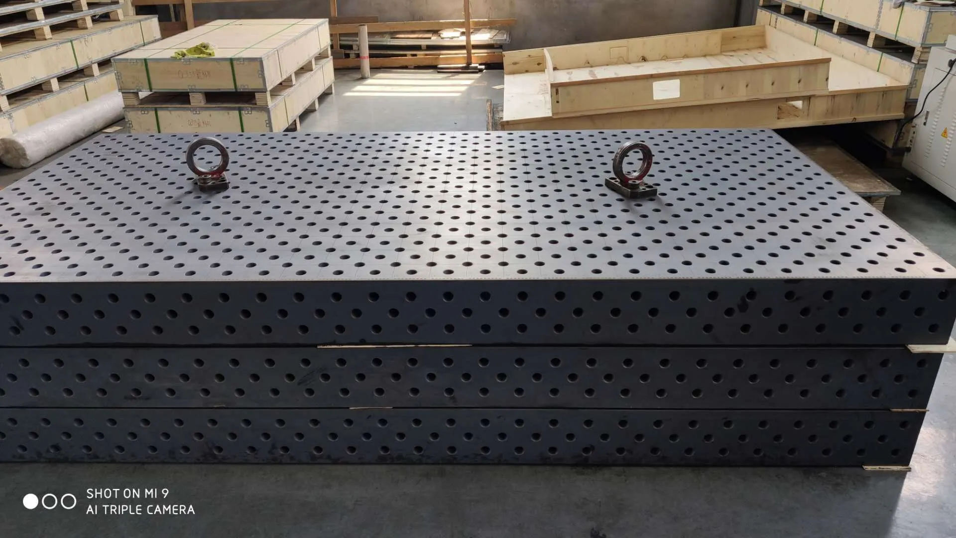 Quality inspector checking the surface of a 3D welding table
